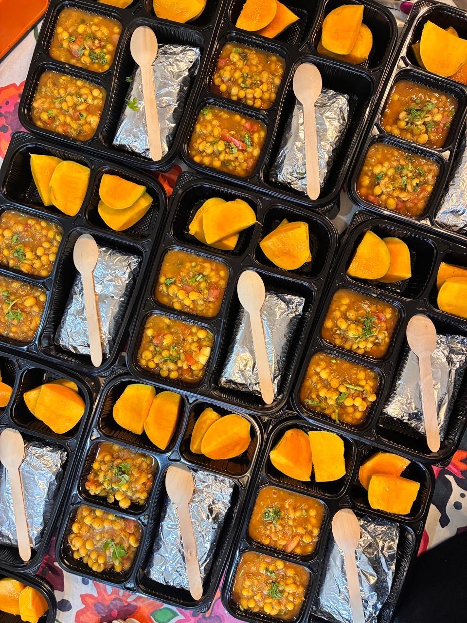 Freshly packed chole meals with mango prepared by Mom's Delight
