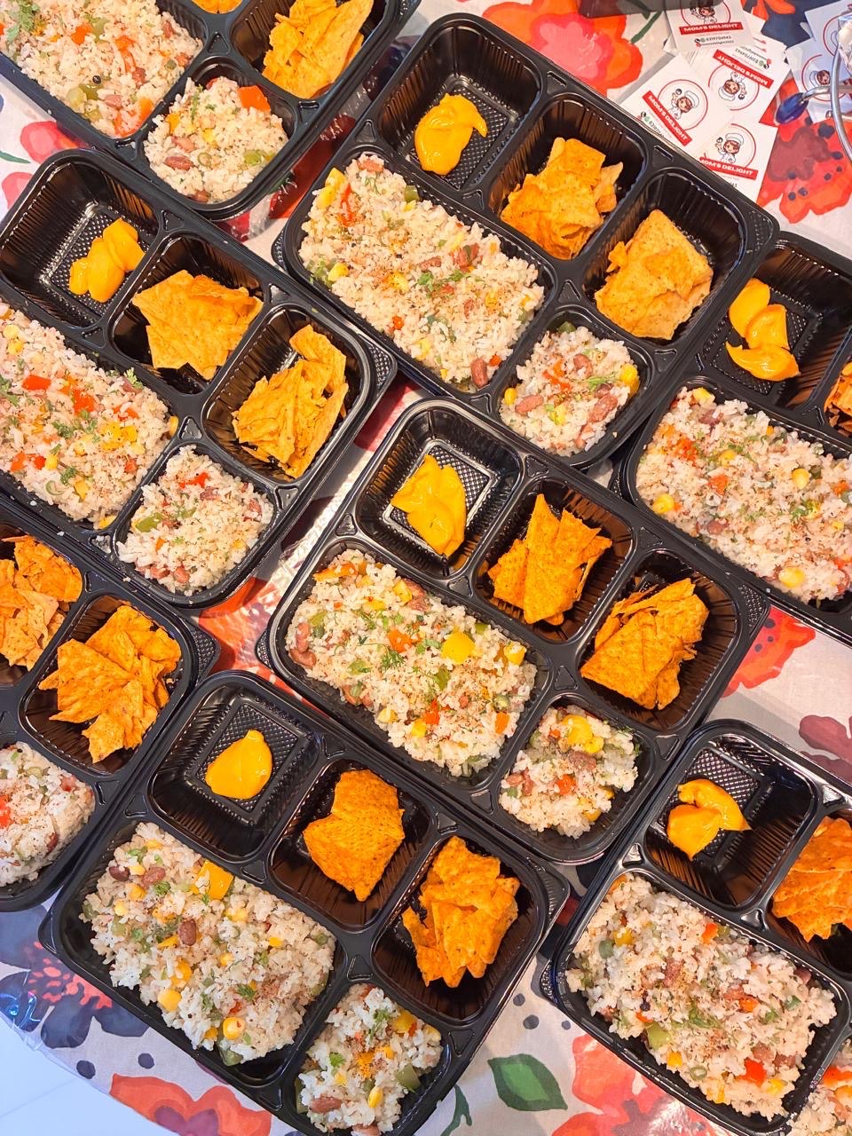 Fresh vegetable fried rice meal boxes prepared by Mom's Delight