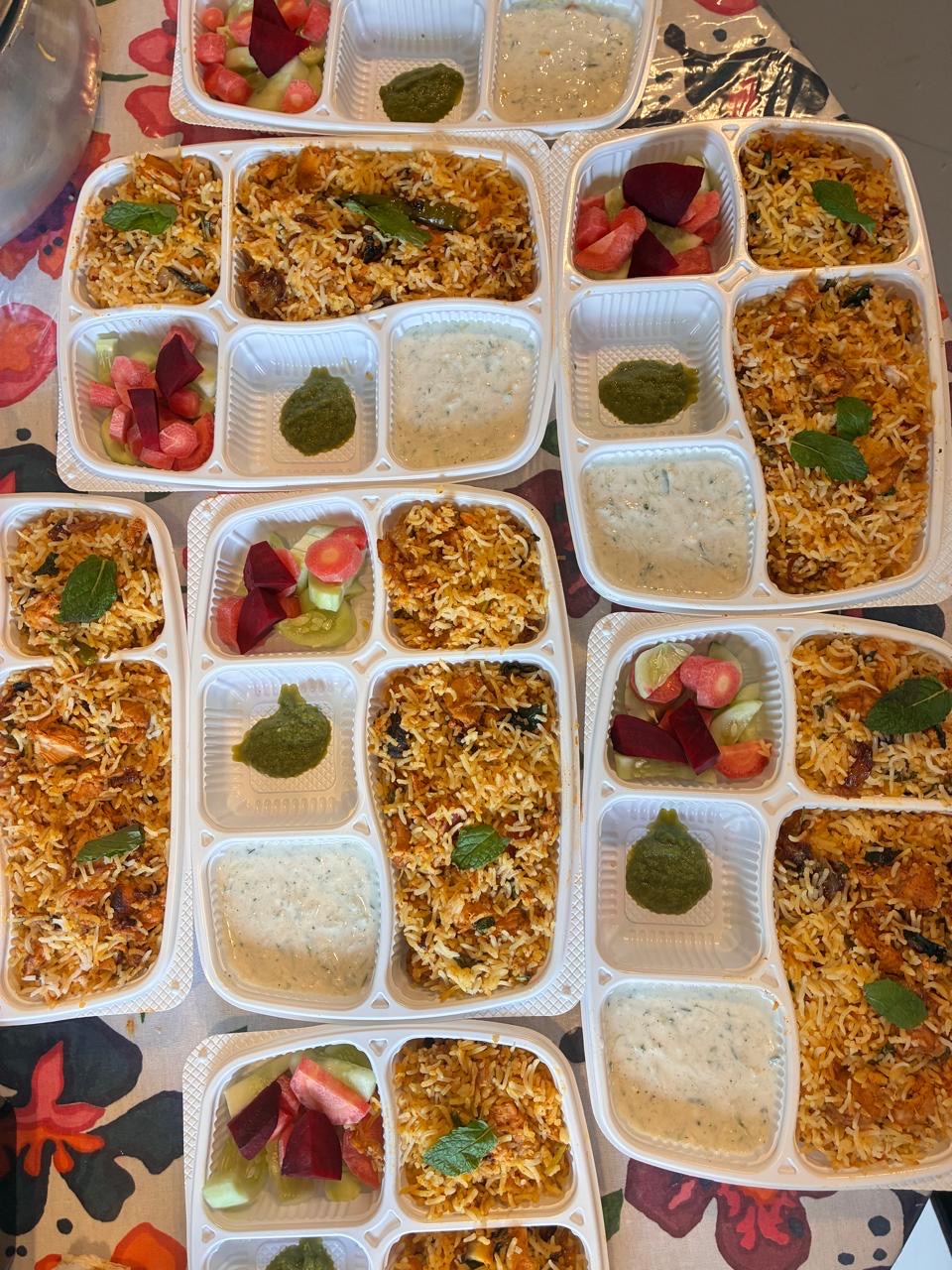 Freshly packed biryani meals prepared by Mom's Delight